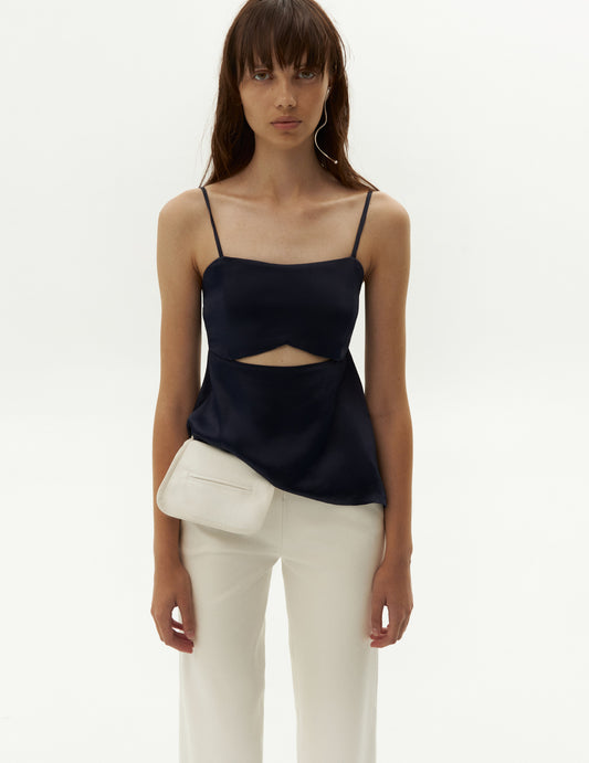 This exquisite piece features alluring front cut-out details that exude contemporary flair. Its flattering short length and straight hemline beautifully accentuate your silhouette for any occasion. Sleeveless top with spaghetti straps from forma clothing. Шовковий топ з відкритою спиною та вирізами від бренду форма