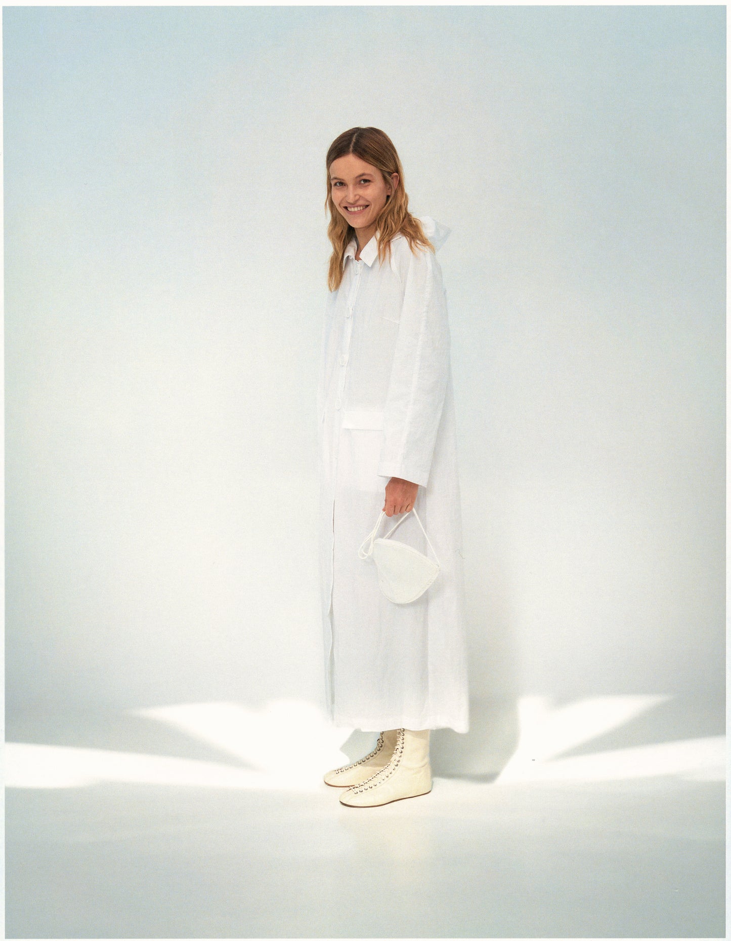 white raincoat from forma online store