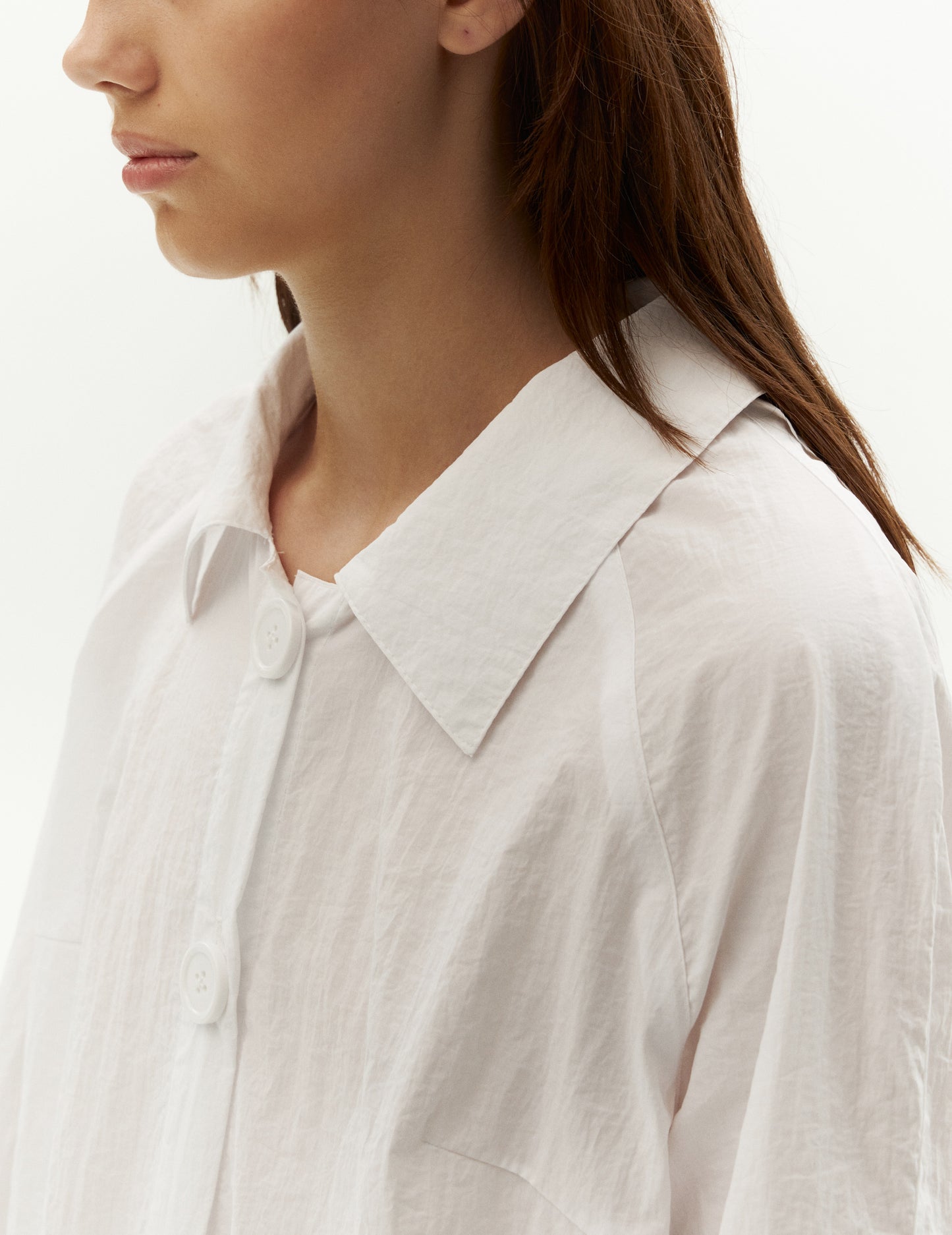 white raincoat from forma online store