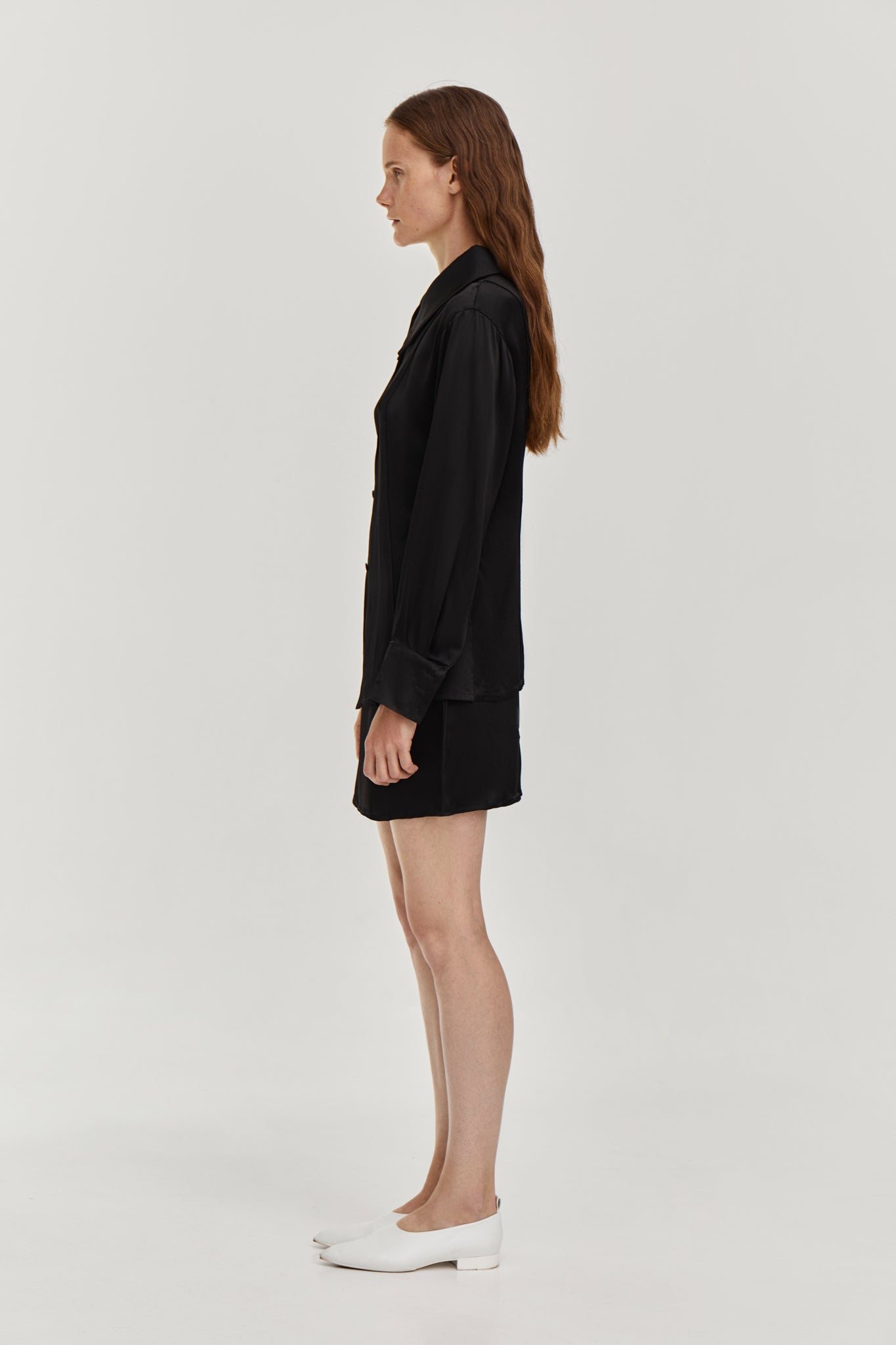 Silky viscose suit with mini low waist skirt and Fitted-waist silky blouse in Black color from FORMA brand