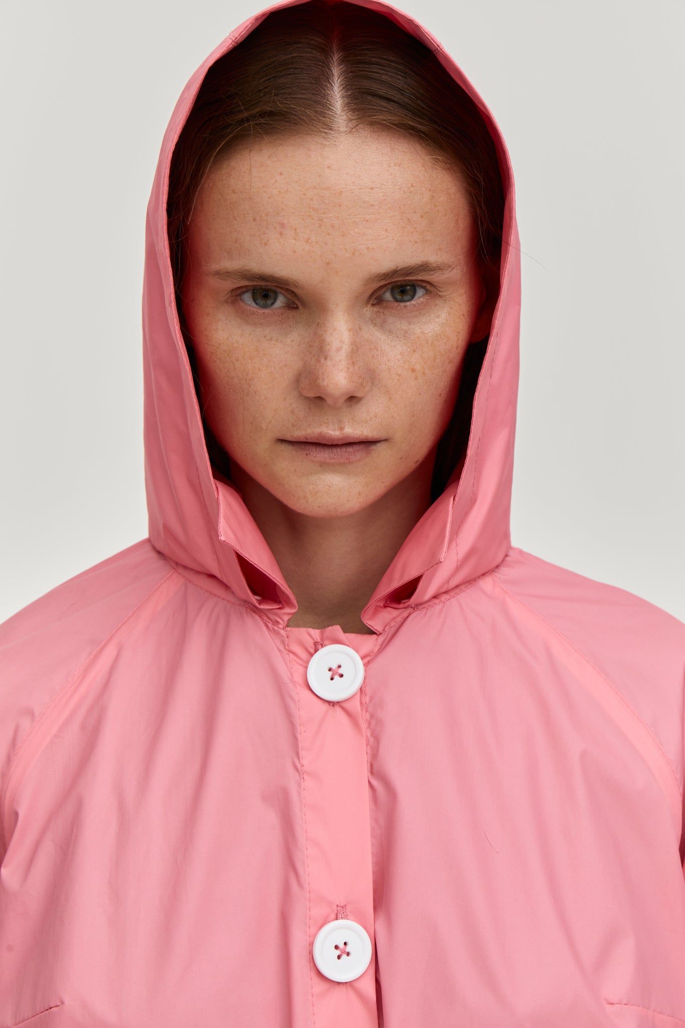 Summer raincoat with removable hood. Made from pink waterproof and breathable fabric. FORMA clothing