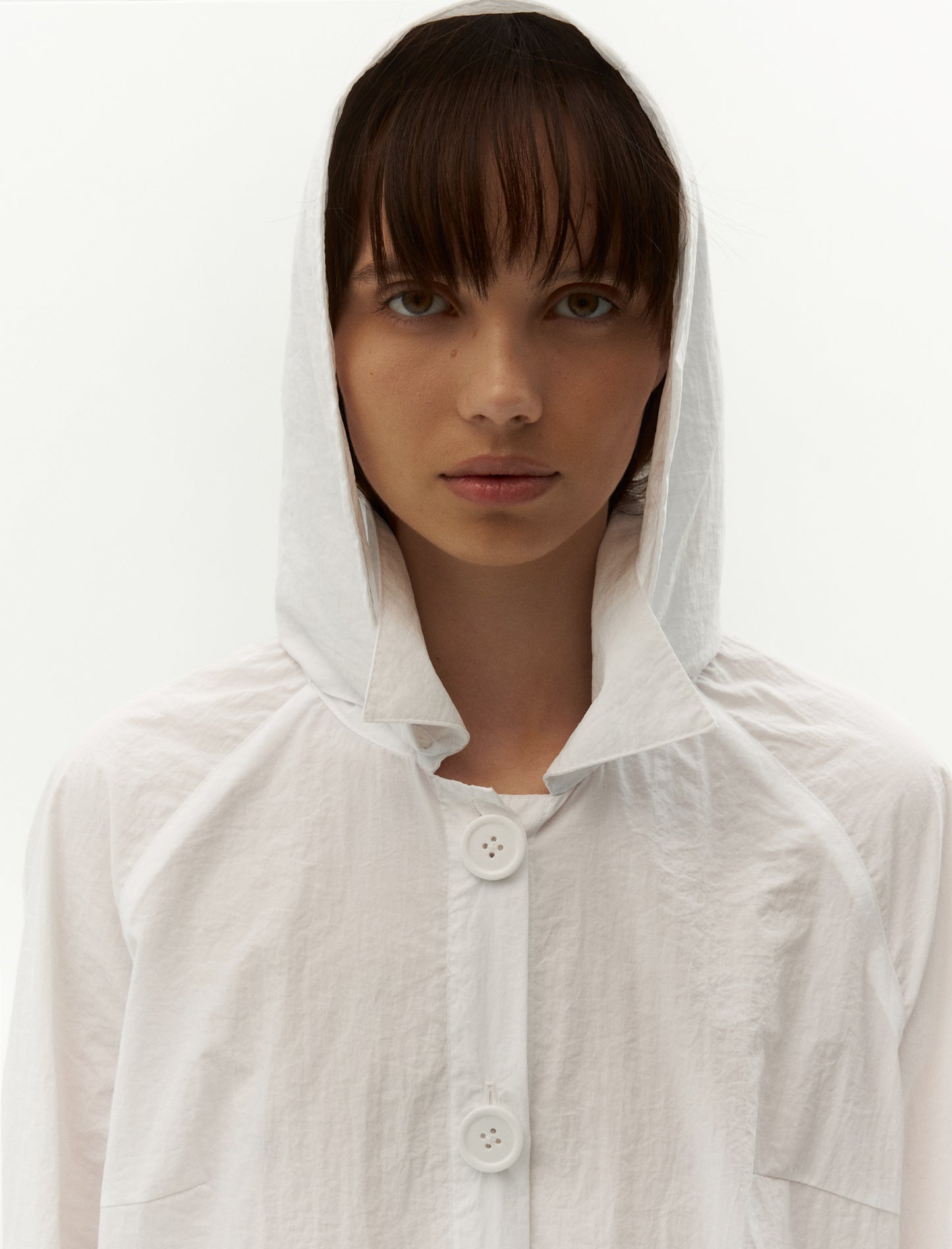 raincoat with hood in white color. Forma fashion brand