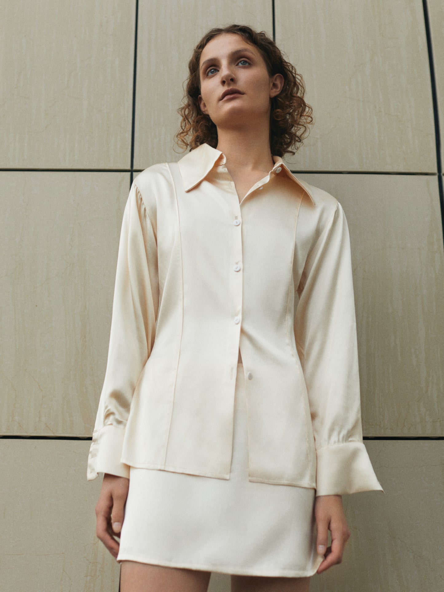 silky suit mini skirt and blouse in creme color from FORMA clothing brand