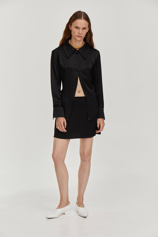 Silky viscose suit with mini low waist skirt and Fitted-waist silky blouse in Black color from FORMA brand