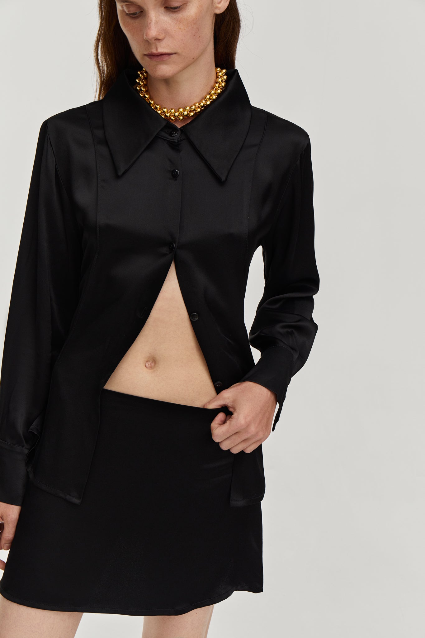 Silky viscose suit with mini low waist skirt and Fitted-waist silky blouse in Black color from FORMA brand